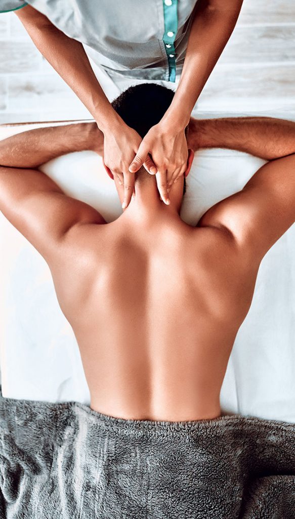 Shoulder And Neck Massage For Man In Spa Salon. Doctor Making Neck