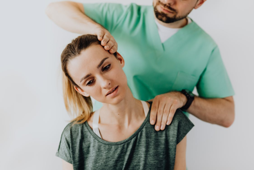 A chiropractic providing a service to a patient